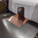 registered and wound through the press
